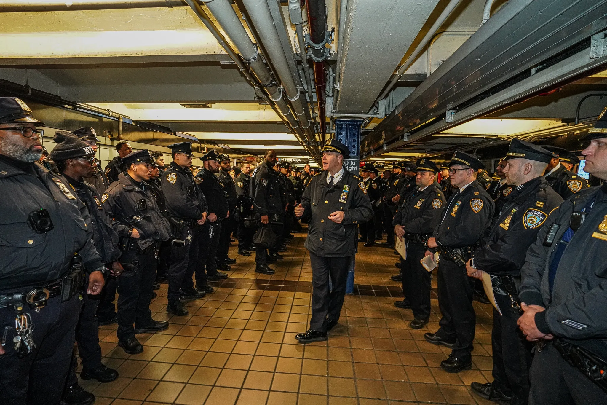 NYPD officers lined up in an underground station during a security briefing for New Year's Eve crowd control in Times Square.