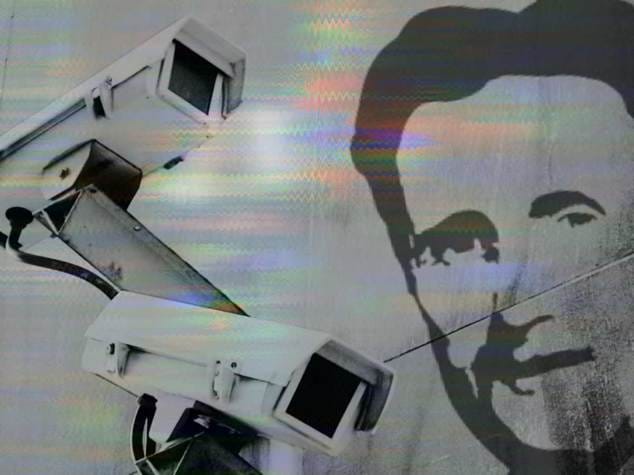 Two surveillance cameras monitor a space, symbolizing the theme of constant surveillance in Orwell's "Nineteen Eighty-Four."